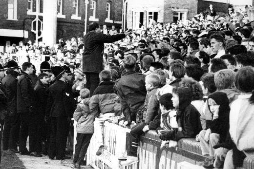 A press photograph of police trying to calm the crowd at the Yorkshire Cup Final match, Featherstone v. Express. Bradford