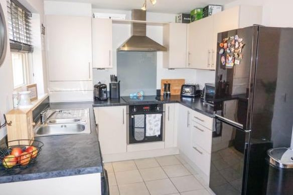 The kitchen diner is modern with fitted appliances and room for a large fridge freezer.