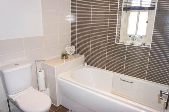 To complete the first floor there is a tiled, modern bathroom with a bath with fitted shower unit.