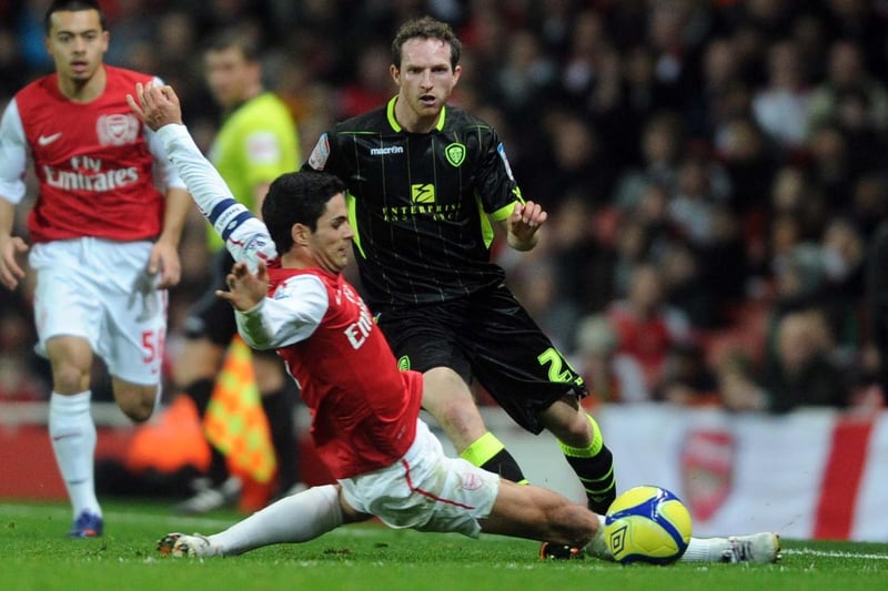 Aidy White is tackled by Arsenal's Mikel Arteta during the FA Cup third round clash at the Emirates in January 2012. Leeds lost 1-0.