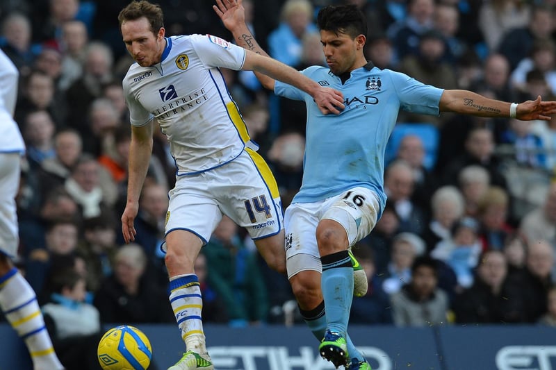 Aidy White holds off Manchester City's Sergio Aguero during the fifth round FA Cup clash at the Etihad Stadium in February 2013.