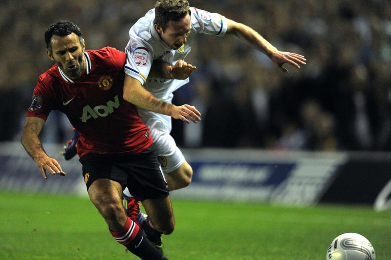 Aidy White battles for the ball with Manchester United's Ryan Giggs during the Carling Cup third round clash at Elland Road in September 2011.