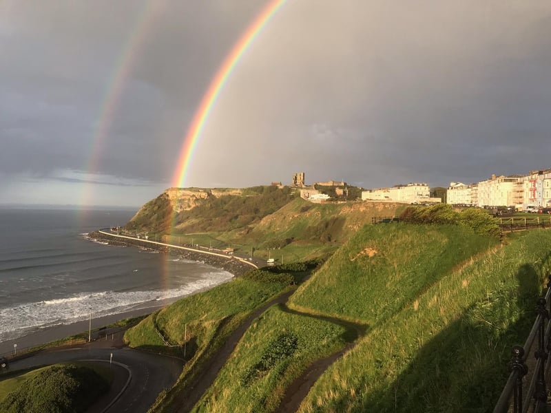 The beautiful colours break through the stormy rain clouds.