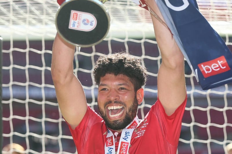 Morecambe's Nat Knight-Percival with the trophy (Photo: Rob Newell/CameraSport)