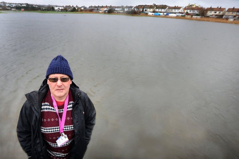 Former councillor Mike Howard pictured with one of the flooded fields at Bulverhythe recreation ground in 2014. SUS-210703-114141001