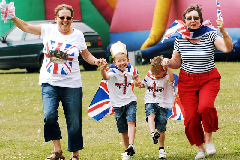 Organisers Jenny Netley, left, and Liz Kenney join with Alfie and Freddie Netley-Harris at Hunston for the royal wedding knees-up. Picture: Bill Shimmin C110696-1