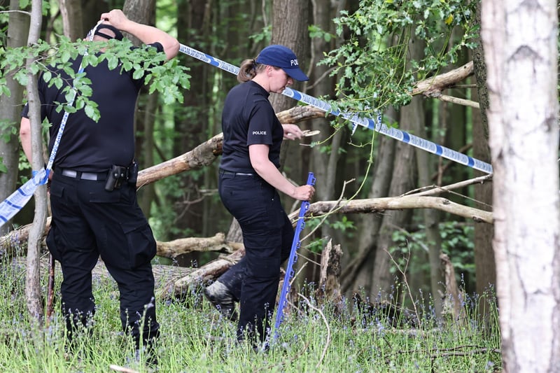 Police at the scene following the discovery of the body. SUS-210206-145107001