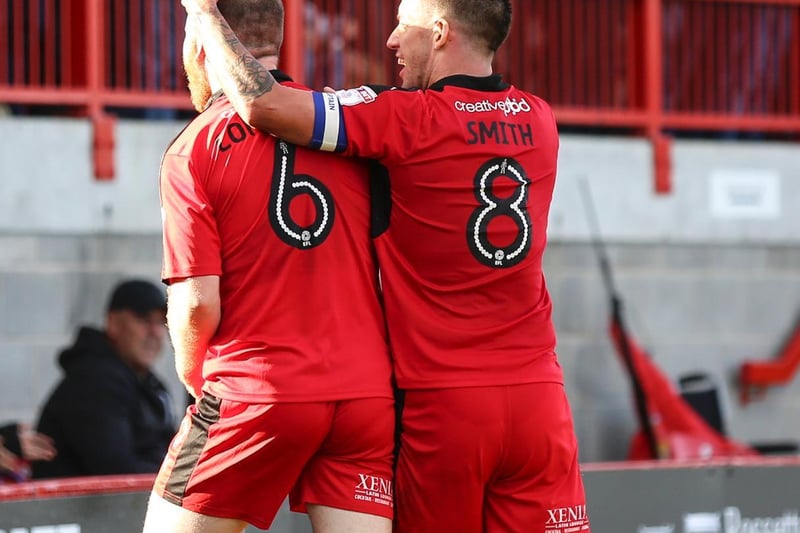 Smith celebrates with goalscorer Mark Connolly against Blackpool