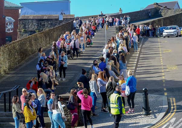 Hundreds of shoppers queue outside Primark on Friday morning as non-essential retails outlets reopen. Photo: George Sweeney / Derry Journal.  DER2117GS – 015