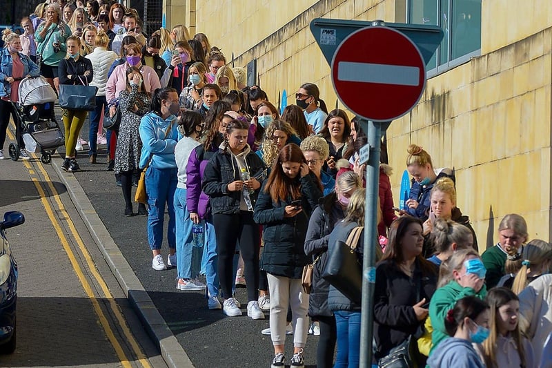 Hundreds of shoppers queue outside Primark on Friday morning as non-essential retails outlets reopen. Photo: George Sweeney / Derry Journal.  DER2117GS – 016