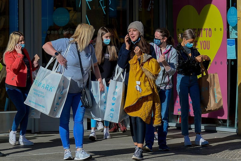 Happy early morning shoppers on Friday as non-essential retails outlets reopen. Photo: George Sweeney / Derry Journal.  DER2117GS – 018
