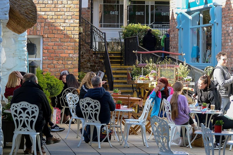 People relax in the Craft Village on Friday morning as cafes reopened. Photo: George Sweeney / Derry Journal.  DER2117GS  045