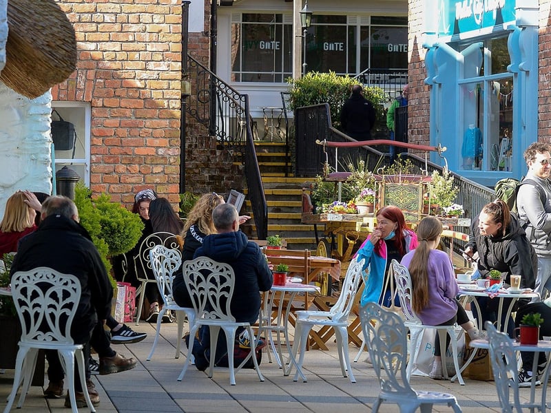 People relax in the Craft Village on Friday morning as cafes reopened. Photo: George Sweeney / Derry Journal. DER2117GS 045