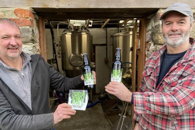 Gary Olvanhill, left, and Pat Garrett with a pump clip and bottles of their new craft beer called Fairytale of New York Picture by Frank Reid.