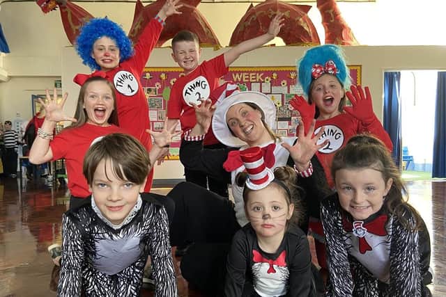 Mrs Keene joins pupils dressed as the Cat in the Hat at Fens Primary School.