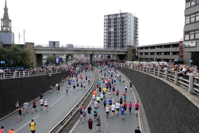 Spectators line the Great North Run route in central Newcastle. Picture: PA.