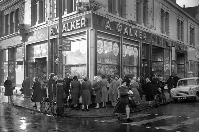 A busy scene outside Walkers' Butchers at the corner of Musgrave Street and Lynn Street back in the 1950s.