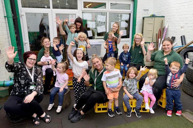 Sharon Birch (rear centre) with staff and pupils at the nursery.
