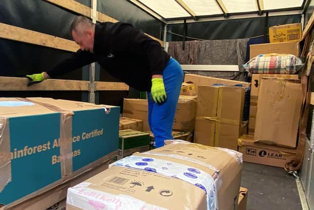 The driver loading his van at Hogg Global Logistics with donated items. Picture by FRANK REID