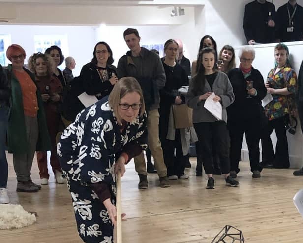 Johanna Bolton Sweeping up her Artworks