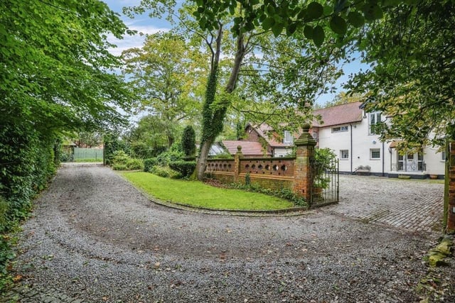 This detached home has a long private drive.