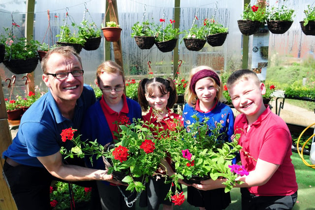 Stuart White, outreach manager for Lynnfield and Stranton children's centres, plants flowers with Stranton Primary School pupils Ellie Trainer, Kadee Dack, Charlotte Singleton and Mark Popplewell in 2014.
