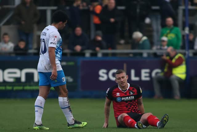 Hartlepool United's David Ferguson goes down with discomfort during the League Two match with Barrow. (Credit: Michael Driver | MI News)