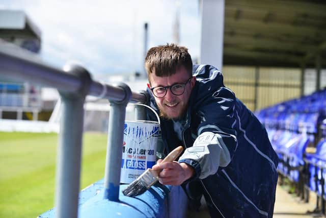 Hartlepool United fan Adam Davison gives Victoria Park a lick of paint ahead of Saturday's game. Picture by FRANK REID
