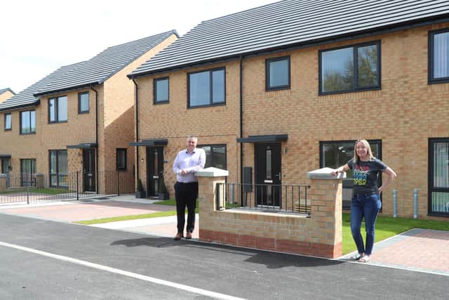 Chris Price, of Tolent with believe housing's Rebecca Marshall at Teign Close, Peterlee.