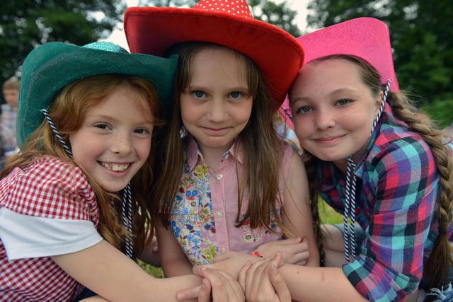 Charley Todd, Amy Fielding and Katie Connelly in their cowgirl hats at the Eldon Academy Strawberry fun day 8 years ago.