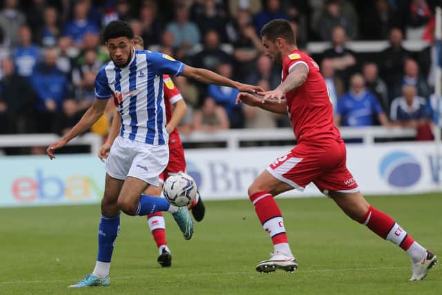 Tyler Burey of Hartlepool United in action with Crawley Town's Tom Dallison during the Sky Bet League 2 match between Hartlepool United and Crawley Town at Victoria Park, Hartlepool on Saturday 7th August 2021. (Credit: Mark Fletcher | MI News)