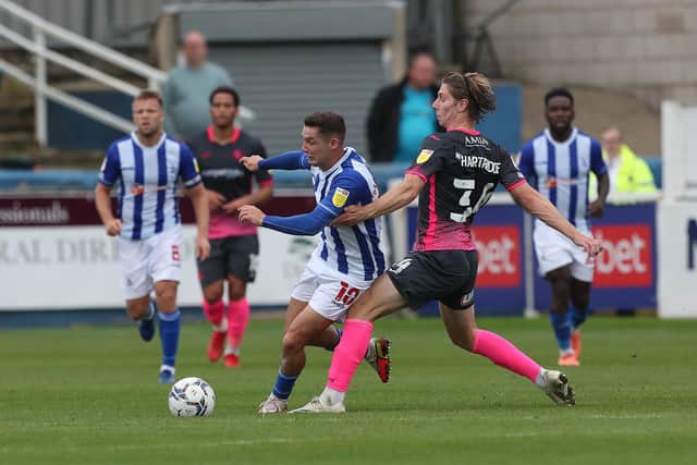 Hartlepool United's Luke Molyneux battles with Exeter City's  Alex Hartridge during the Sky Bet League 2 match between Hartlepool United and Exeter City at Victoria Park, Hartlepool on Saturday 25th September 2021. (Credit: Mark Fletcher | MI News)