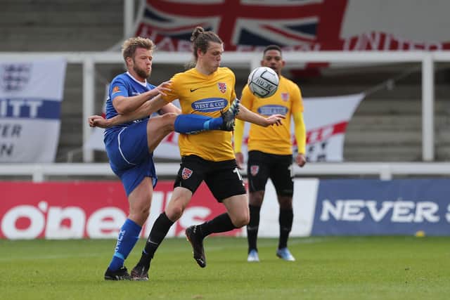 Nicky Featherstone of Hartlepool United in action with Matt Robinson during the Vanarama National League match between Hartlepool United and Dagenham and Redbridge at Victoria Park, Hartlepool on Friday 2nd April 2021. (Credit: Mark Fletcher | MI News)