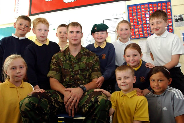 Soldier Gavin Bage, pictured alongside Golden Flatts pupils in 2003.