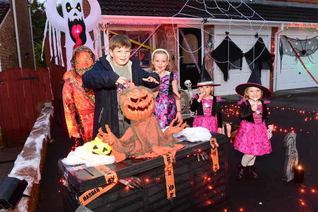 Children Charlie Martin, Harrison Martin, Abbey Ampleford, Millie Ampleford and Georgie Martin show off a scary display.