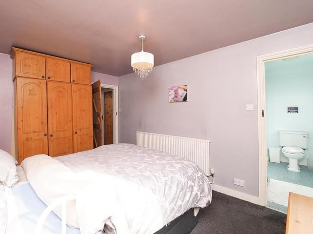 All four bedrooms are a similar size, but this is the main one because, as you can see, it possesses its own en suite facilities, comprising a shower enclosure, wash hand basin with vanity unit and low-level WC. The bedroom itself, which overlooks the back of the property, has a fitted wardrobe.