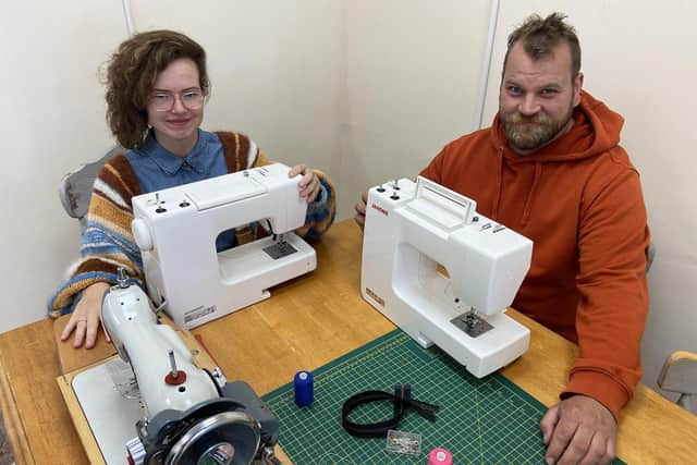 Anika and Mark Sanders in their new sewing shop.