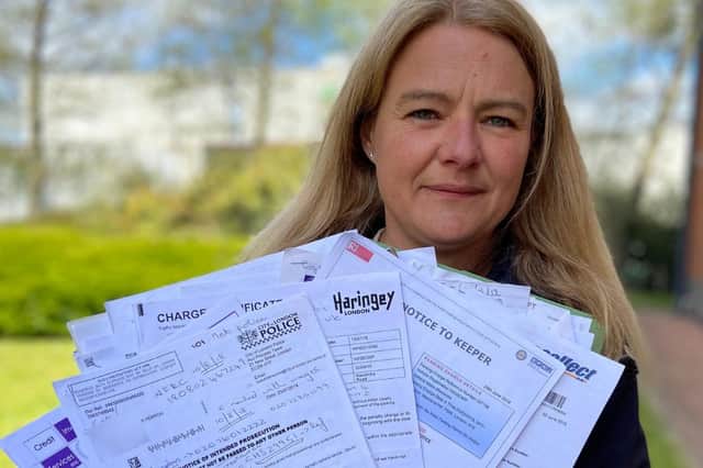 Clare Herron with some of the fines she received after her car registration was cloned.