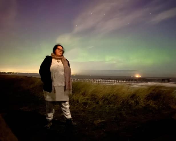 Edward Martin's girlfriend Sarah against the backdrop of the Northern Lights on Saturday night.