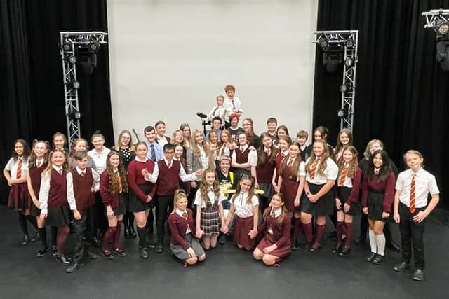 The cast of High Tunstall College of Science's School of Rock The Musical.