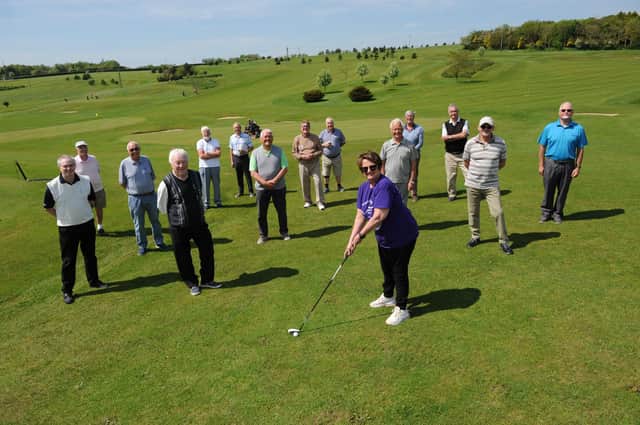 Janice Forbes from Alice House Hospice with members of the High Throston Golf Club senior section who have raised £500 for the charity.