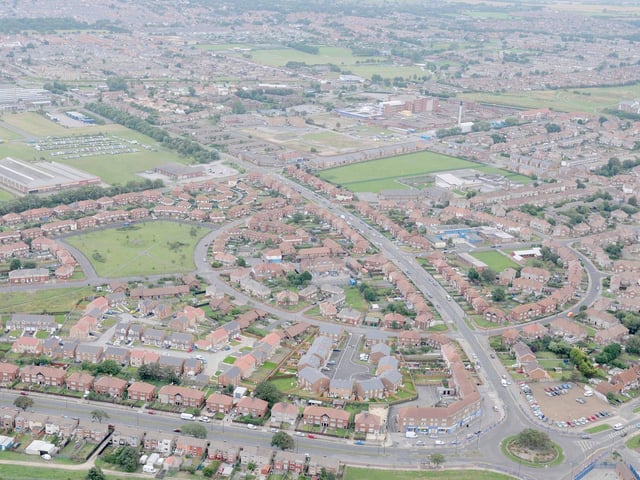 A bird's eye view of West View taken in 2010 showing the Brus Corner shops and roundabout at the bottom right of the picture. The circular Bruce Crescent is in the centre of the picture with Winterbottom Avenue heading through it.