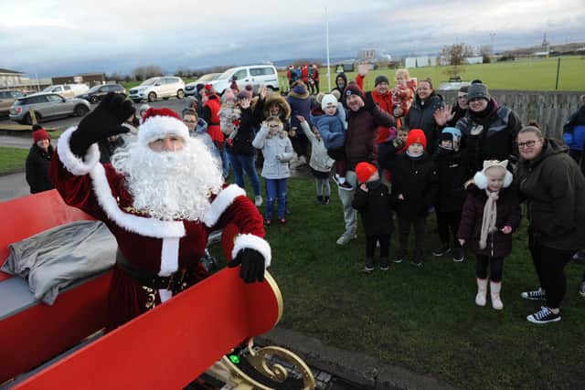 Youngsters greet Santa and his sleigh at Seaton Carew's Hornby Park, at the start of Hartlepool's Round Table Santa Tour.