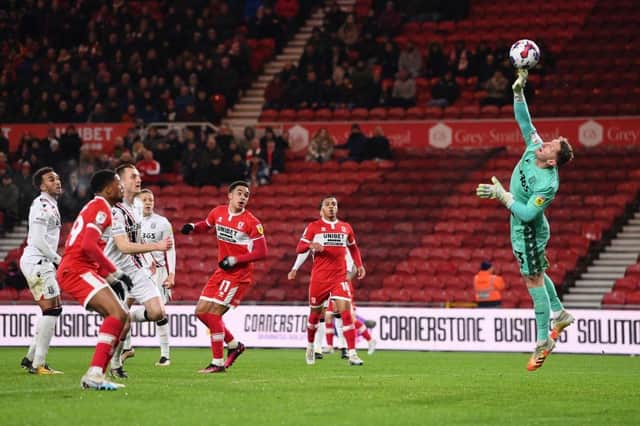 Jack Bonham of Stoke City saves a shot from Aaron Ramsey of Middlesbrough. (Photo by Stu Forster/Getty Images)