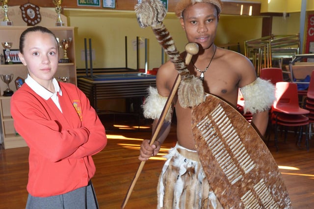 Ellie Turnham poses alongside Khayelihle Ngubane from The Lions of Zulu Land in 2015.