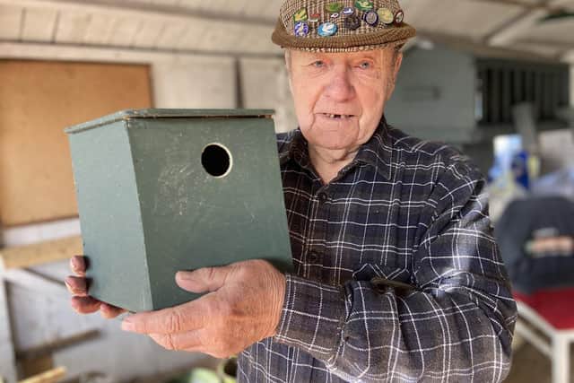 Bob Collin shows off one of his many bird boxes in his Chester Road allotment.