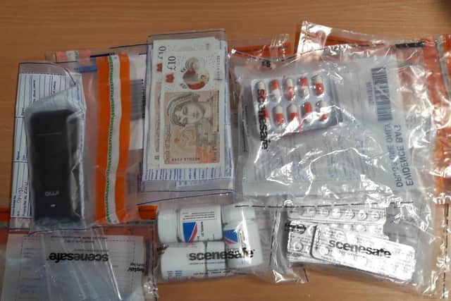 A Cleveland Police picture of the cash and suspected drugs seized in Hartlepool.