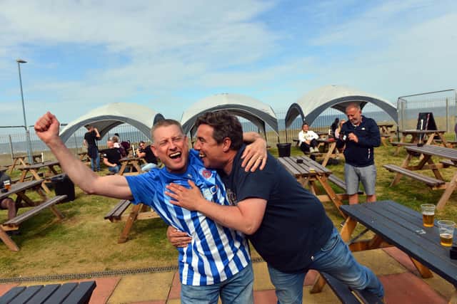 Keith Robinson (left) celebrates with a fellow fan after watching the game at Hornsey's Bar at Seaton Carew.