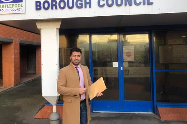 Ary Ahmed who runs a barbers in Murray Street delivers his petition calling for traffic calming measures to Hartlepool Civic Centre.