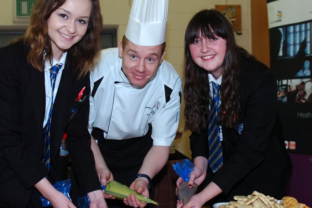 St Hilds School pupils Faith Featherstone and Isobel Wright help Hartlepool College of FE Chef Kevin Dove during the careers day held at the school.
